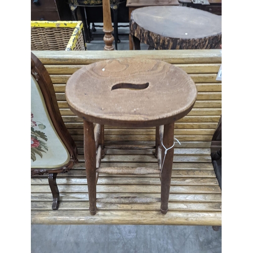 1132 - An elm and beech stool together with a Victorian rosewood tapestry firescreen