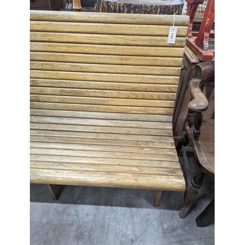 1133 - A vintage slatted wood tram bench, length 140cm, depth 60cm, height 98cm