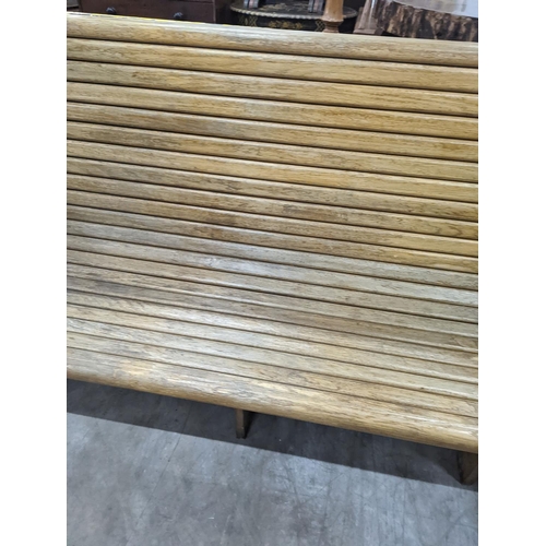 1133 - A vintage slatted wood tram bench, length 140cm, depth 60cm, height 98cm