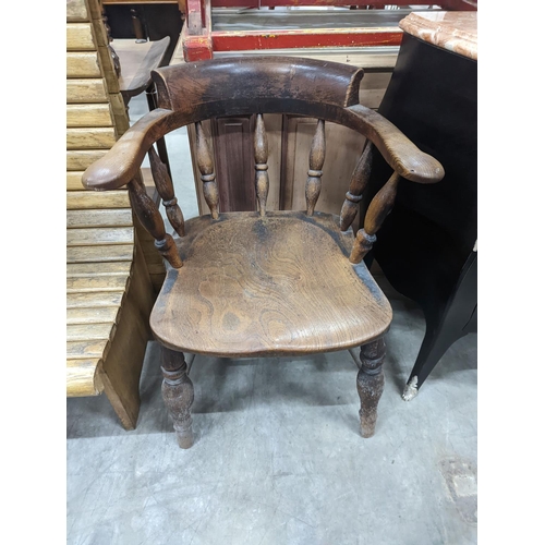 1134 - A Victorian elm and beech smoker's bow chair together with a provincial wood seat chair