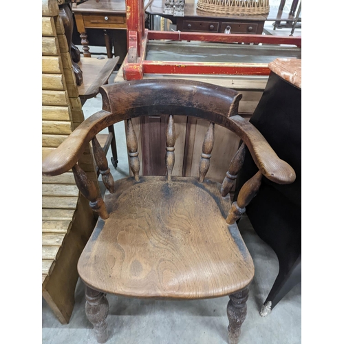 1134 - A Victorian elm and beech smoker's bow chair together with a provincial wood seat chair