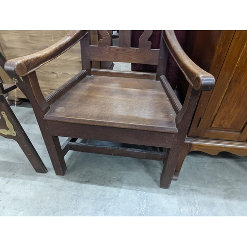 1141 - An Arts and Crafts elbow chair, width 61cm, depth 45cm, height 106cm