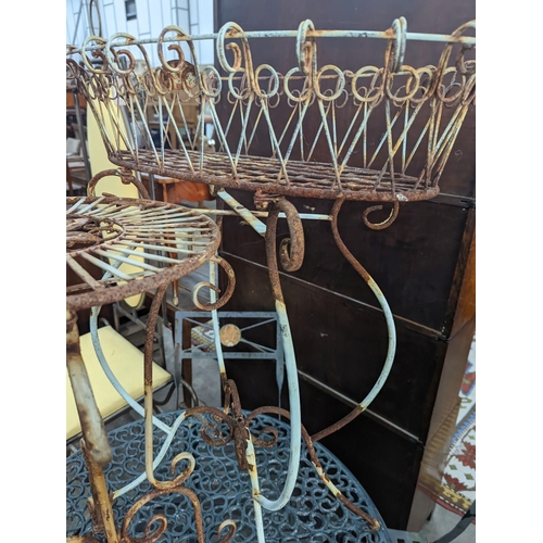 1156 - A painted wirework and wrought iron pot stand, height 79cm together with a similar circular table... 