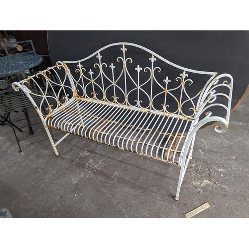 1159 - A painted metal folding garden bench, length 148cm, depth 50cm, height 93cm