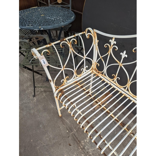 1159 - A painted metal folding garden bench, length 148cm, depth 50cm, height 93cm