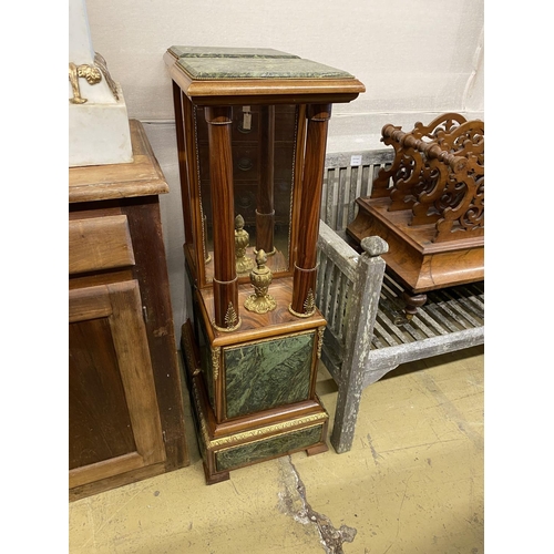 1161 - A pair of Empire style gilt metal mounted walnut mirrored pier tables, width 34cm, depth 24cm, heigh... 