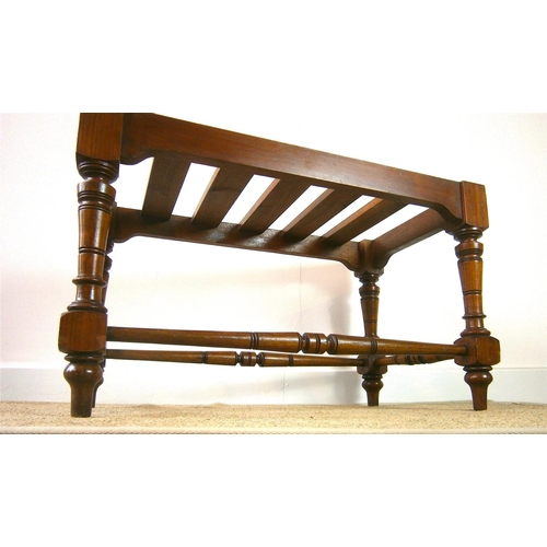 1164 - A late Victorian aesthetic movement walnut luggage stand, length 69cm, depth 38cm, height 41cm... 