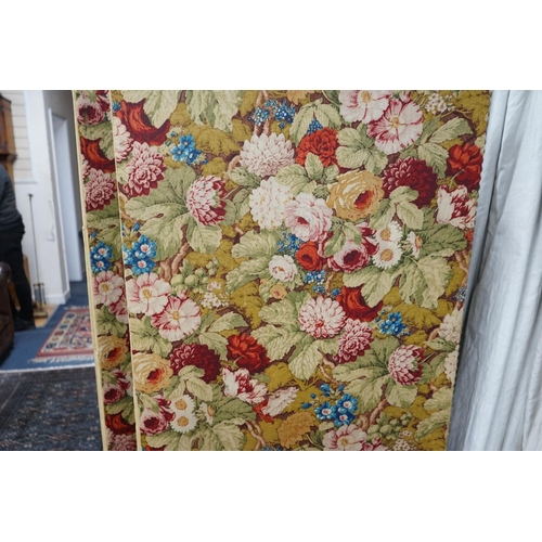 1166 - An early 20th century floral fabric four fold dressing screen, each panel width 67cm, height 176cm... 