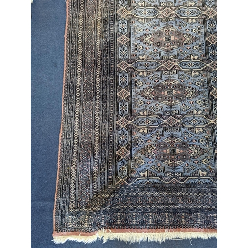 1169 - A Bokhara blue ground rug, 190 x 30cm