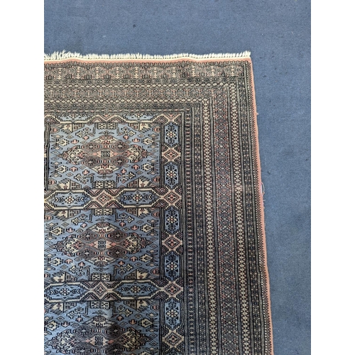 1169 - A Bokhara blue ground rug, 190 x 30cm