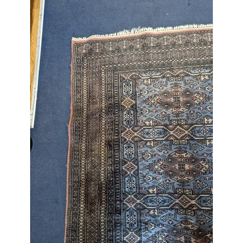 1169 - A Bokhara blue ground rug, 190 x 30cm