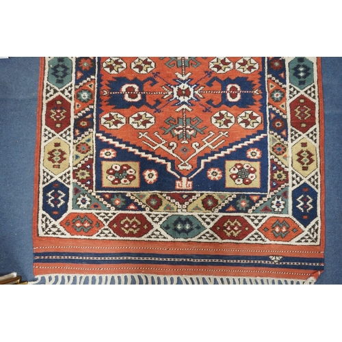 1170 - A Caucasian red ground mat, 120 x 95cm