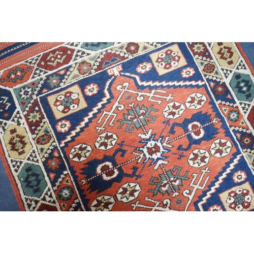 1170 - A Caucasian red ground mat, 120 x 95cm