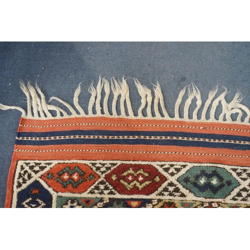 1170 - A Caucasian red ground mat, 120 x 95cm