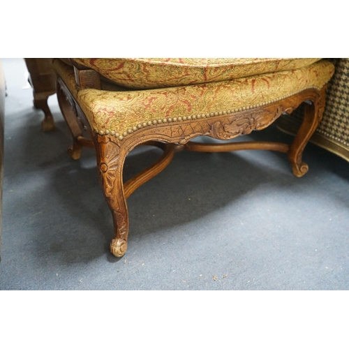 1192 - An 18th century style French walnut upholstered open armchair, width 68cm, depth 60cm, height 108cm... 