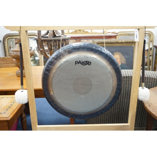 1200 - A Paiste 56cm. gong and a pair of Paiste M3 mallets, on purpose-made oak stand, stand height 124cm... 