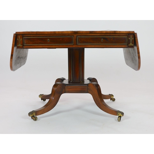 1202 - A Regency brass inset rosewood sofa tableWith D shaped flaps and two freize drawers, on octagonal pe... 