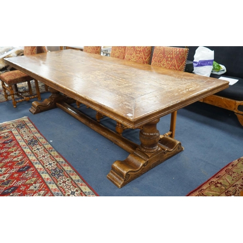 1203 - An 18th century style rectangular walnut refectory dining table on baluster end supports with centra... 