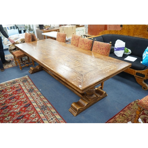 1203 - An 18th century style rectangular walnut refectory dining table on baluster end supports with centra... 