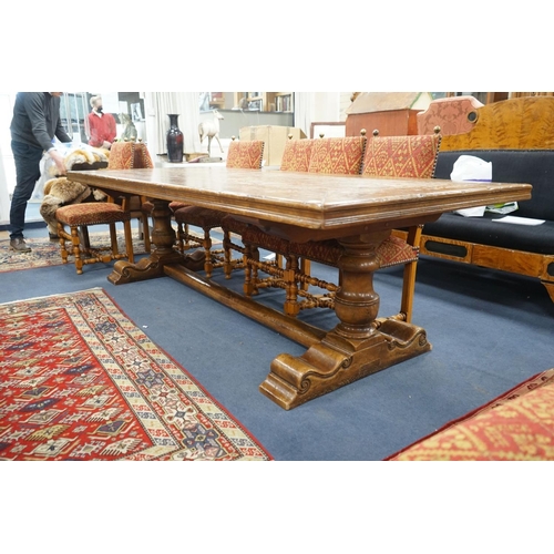 1203 - An 18th century style rectangular walnut refectory dining table on baluster end supports with centra... 