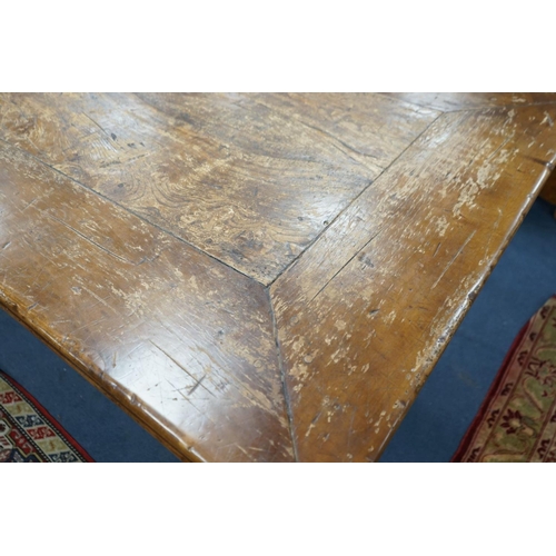 1203 - An 18th century style rectangular walnut refectory dining table on baluster end supports with centra... 