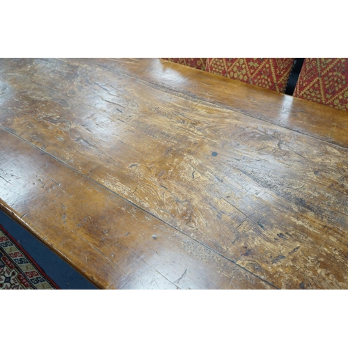 1203 - An 18th century style rectangular walnut refectory dining table on baluster end supports with centra... 