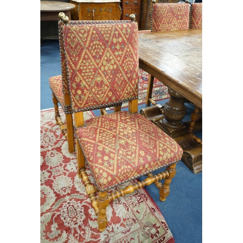 1204 - A set of twelve 18th century style French walnut dining chairs on turned underframes with H stretche... 