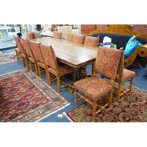 1204 - A set of twelve 18th century style French walnut dining chairs on turned underframes with H stretche... 