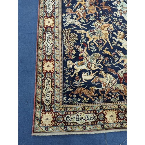 1207 - A Kashan style blue ground pictorial rug, 224 x 144cm