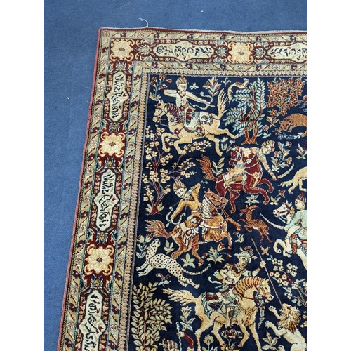 1207 - A Kashan style blue ground pictorial rug, 224 x 144cm