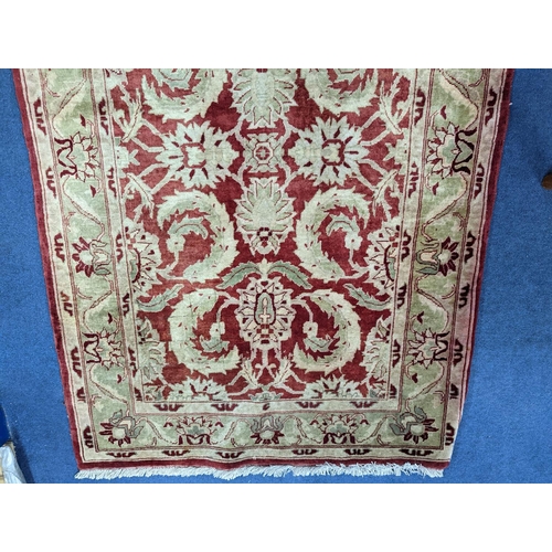 1208 - A Zeigler red ground rug, 160 x 100cm