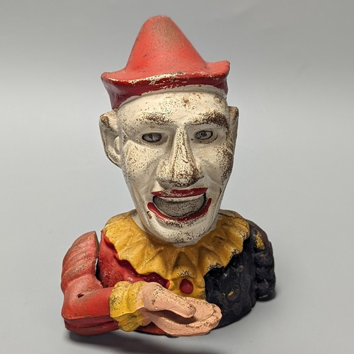 1251 - A cold painted cast iron ‘jester’ money bank 17cm