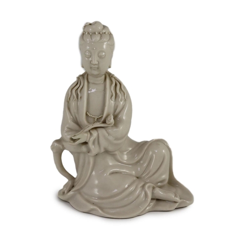 1255 - A Chinese blanc-de-chine seated figure of Guanyin, Dehua kilns, 19th/20th century,holding a ruyi sce... 