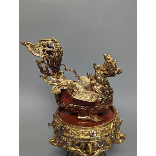 1257 - A Burmese painted gilt decorated metal, wood and composition ‘phoenix’ Betel box, total height 32cm... 