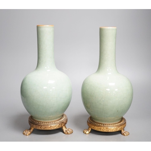 1259 - A pair of Chinese celadon crackle glazed bottle vases with gilt metal stands total height 27cm, base... 