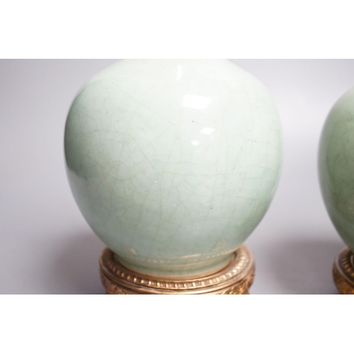 1259 - A pair of Chinese celadon crackle glazed bottle vases with gilt metal stands total height 27cm, base... 