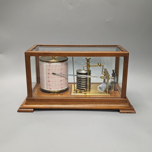 1263 - A Short & Mason oak cased barograph with spare graph paper