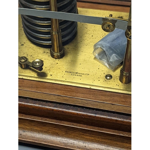 1263 - A Short & Mason oak cased barograph with spare graph paper