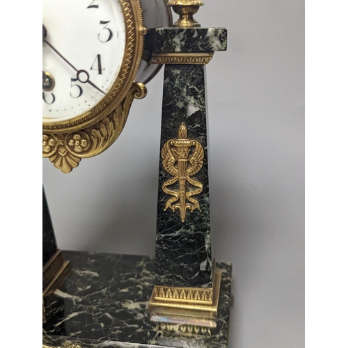 1271 - A French Empire style marble and ormolu portico timepiece  32cm