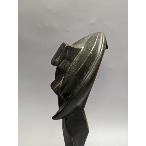 1281 - A 20th century Futurist style patinated bronze sculpture, unsigned. 40cm