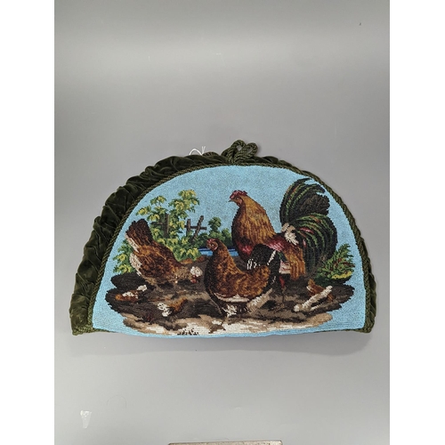 1285 - A 19th century beadwork tea cosy, with chicken design to both sides