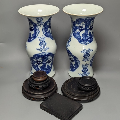 1289 - A pair of Chinese blue and white vases on stands and 6 further wood stands. Vases 35cm