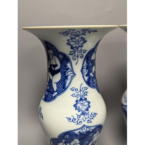 1289 - A pair of Chinese blue and white vases on stands and 6 further wood stands. Vases 35cm