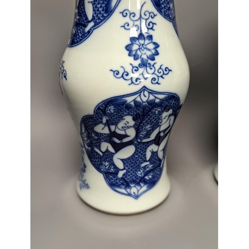 1289 - A pair of Chinese blue and white vases on stands and 6 further wood stands. Vases 35cm