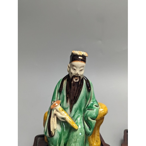 1298 - An 18th century Chinese sancai biscuit group of Guanyin with child and a 19th century Chinese sancai... 