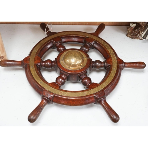 1301 - An early 20th century teak and brass mounted ship’s wheel 64cm