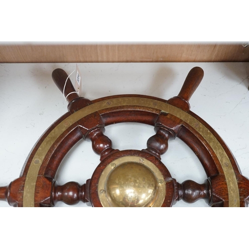 1301 - An early 20th century teak and brass mounted ship’s wheel 64cm