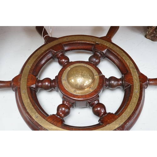 1301 - An early 20th century teak and brass mounted ship’s wheel 64cm