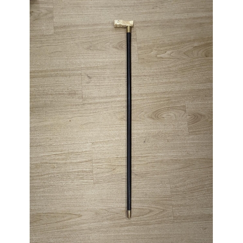 1303 - A bone 'horse head' handled walking stick 90cm