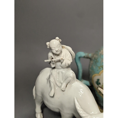 1307 - A 19th century Cadogan shape Chinese wine ewer, a Chinese blanc de chine figure riding an ox, an 18t... 